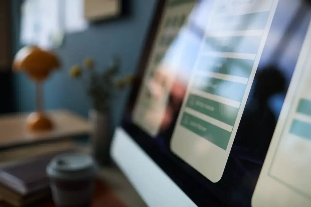 A WordPress website dashboard being monitored on a laptop